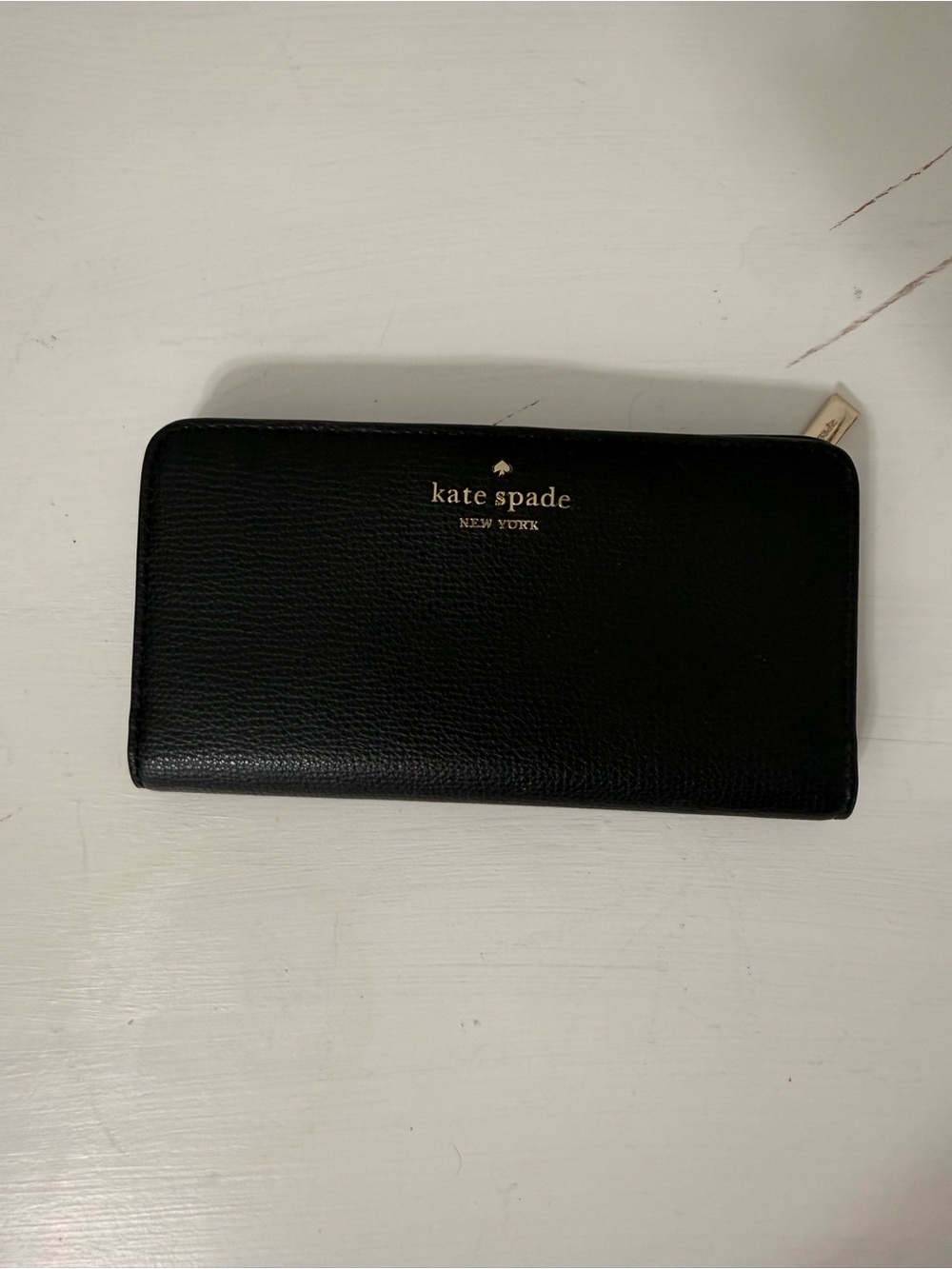 kate spade black leather zip-around continental wallet with gold logo